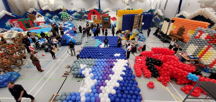 Balloon artists from around the world have created an array of London Christmas sights out of more than 125,000 balloons to raise funds for four Surrey charities