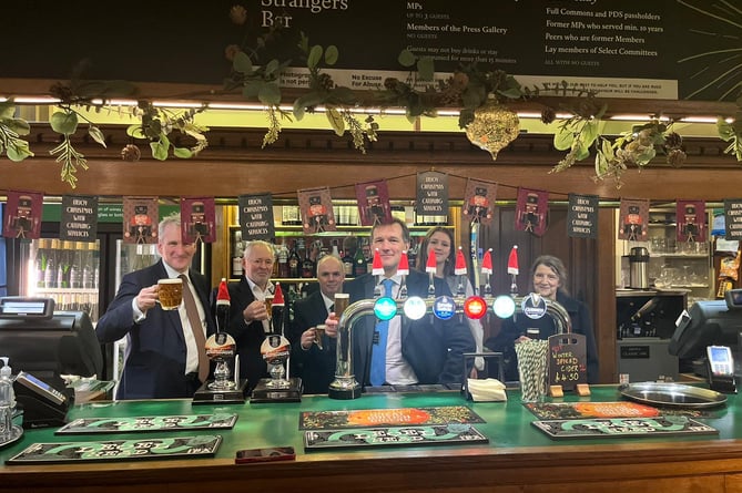 East Hampshire MP Damian Hinds and the Triple fff Brewery team sample Sundown in the Strangers' Bar, House of Commons, December 2023.