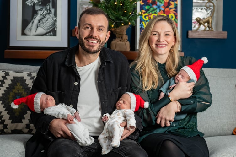 Chris Wise and Hannah Gurney with triplets Ava, Alba and Emil at their home in Portsmouth, December 19 2023. Release date â December 20, 2023. See SWNS story SWSMtriplets. Meet the miracle triplets who arrived home in time for Christmas - after arriving eight weeks early and spending five weeks in hospital. Little Emil, Ava, and Alba Wise, now six weeks, were able to finally leave the Queen Alexandra Hospital, Portsmouth after arriving at 32 weeks on November 1. Their proud parents Hannah Gurney, 36, and her partner, Chris Wise, 38, a sports broadcaster, had planned to have a c-section at 34 weeks but Hannah went into labour a fortnight early. Ten hours later, they welcomed Emil, Ava, and Alba - weighing 3lbs 3oz, 3lbs 2oz and 3lbs 1.5oz respectively. After spending five weeks in intensive care gaining strength and growing, the babies were discharged on December 5, 2023. Hannah and Chris have now brought the triplets home and are ready to spend a quiet Christmas as a family of five.