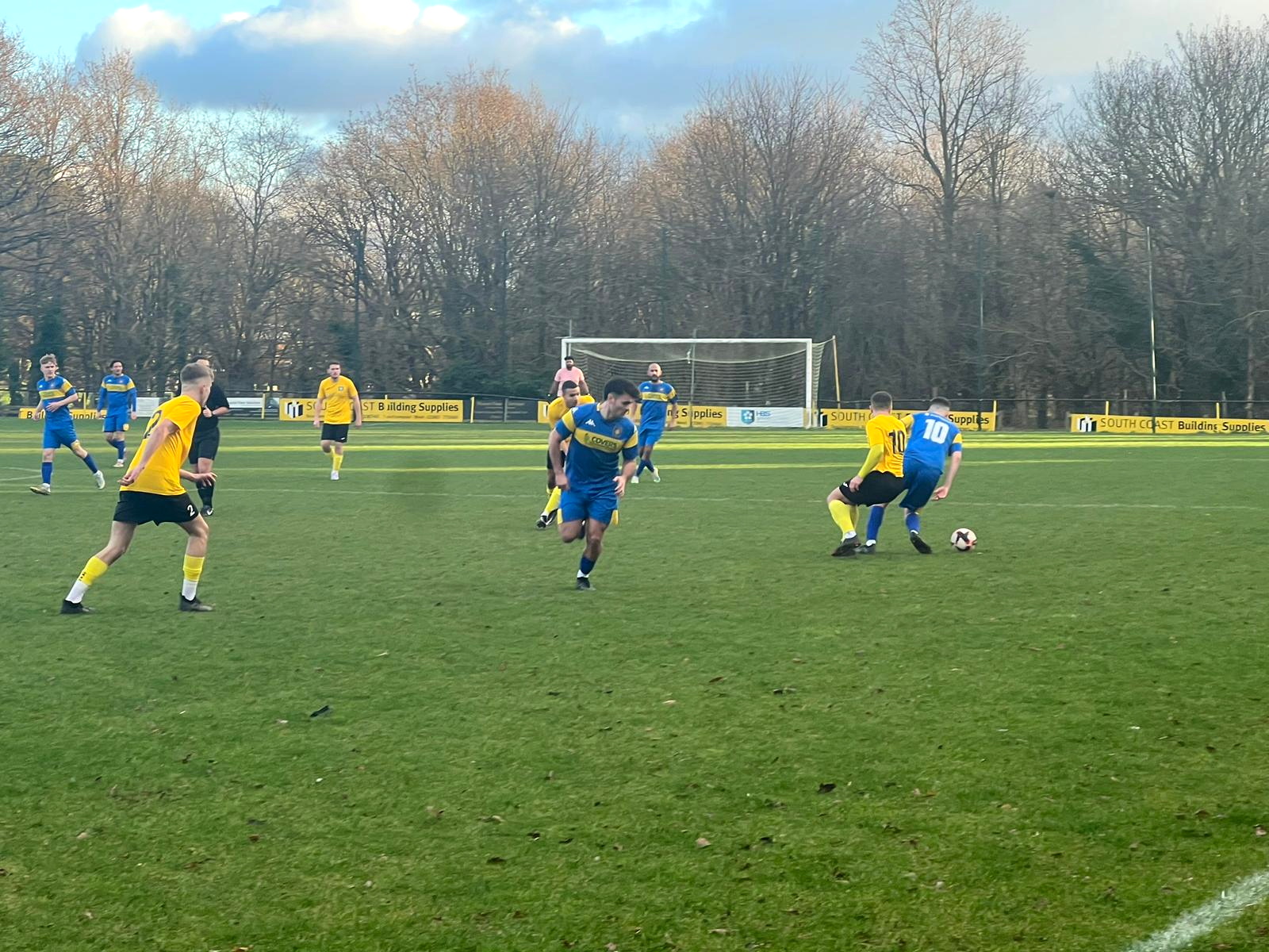 Petersfield’s Tommy Tierney on the ball at Hamble