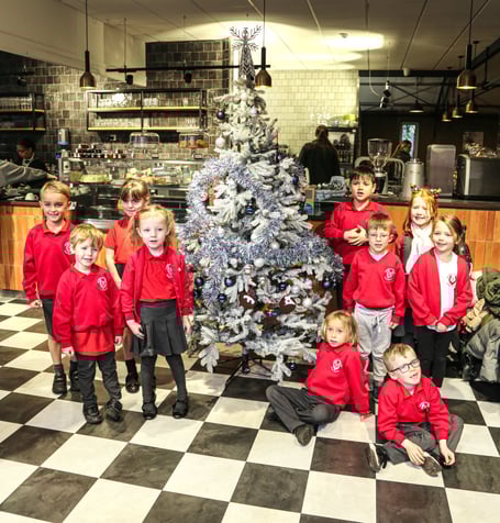 Pupils from Badshot Lea Village Infant School with the finished tree