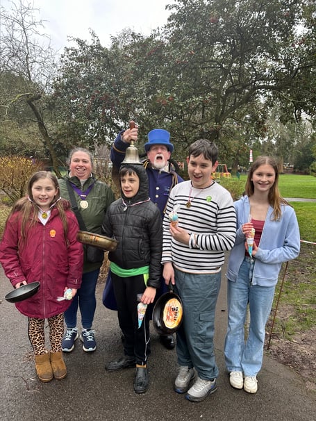 Alton Pancake Race secondary school winners Chloe, Phoebe, Dexter and Liam with Cllr Annette Eyre and town crier Dave Parsons, Public Gardens, February 13th 2024.