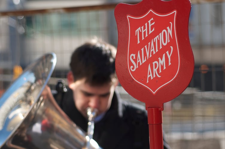 A Salvation Army band, composed of young musicians, plays in front of Union Station in Toronto.  Raising money for the Red Kettle fund.  It was heartening to see these young folks out on a bitterly cold day giving their time for those less fortunate.  By the look of some of the large bills in their kettle, their example of charity pried open more than a few wallets.