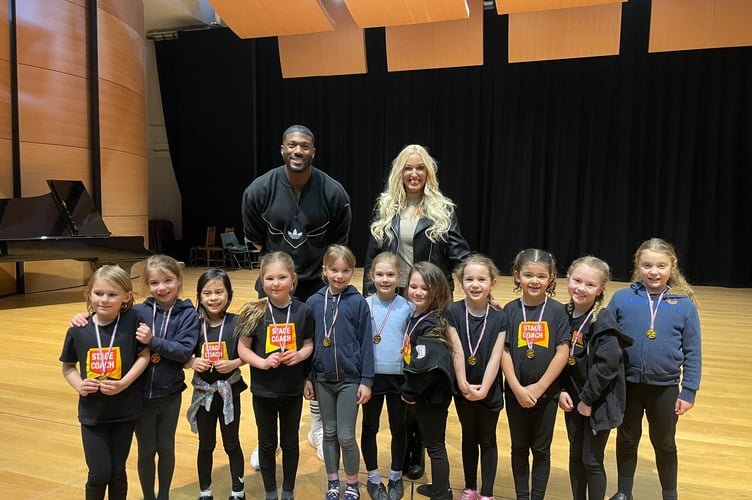 BBC Gladiator Toby 'Phantom Menace' Olubi and broadcaster Hayley Palmer with Stagecoach Godalming students