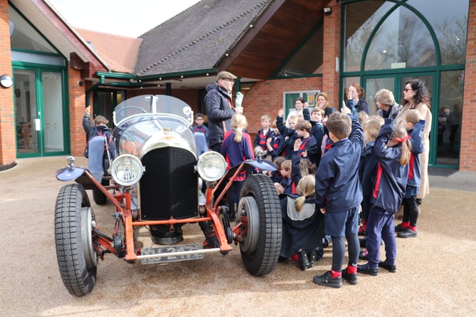 Pre-prep children at Highfield and Brookham get a close look at one of William Medcalf’s vintage cars