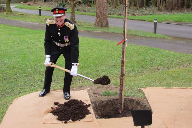 The Lord Lieutenant of Surrey, Mr Michael More-Molyneux plants an Acer griseum in memory of Sister Mary Agnes.                     
