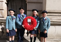 Haslemere school pupils lay wreath at the Cenotaph on St George's Day