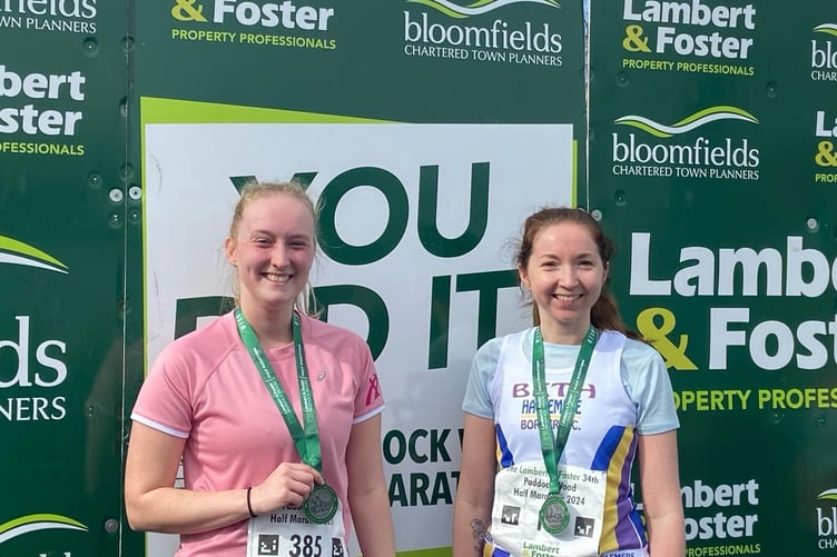 Beth Sutton (right) with her medal having completed the Paddock Wood Half Marathon