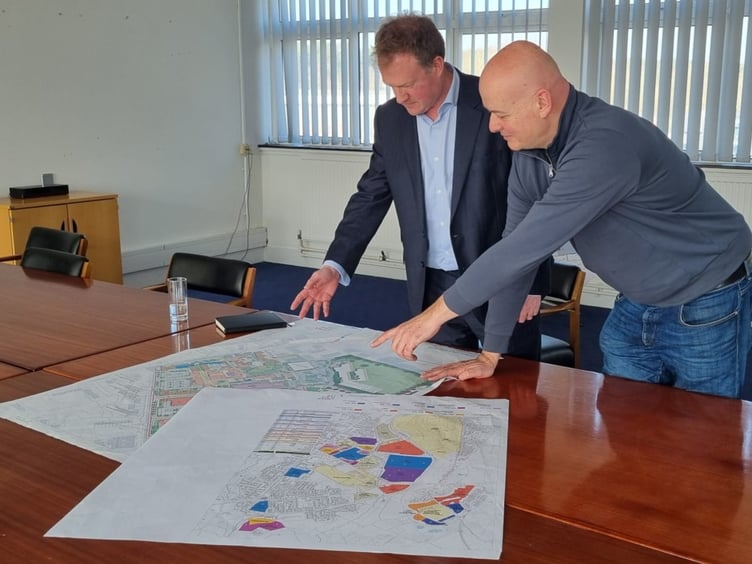 Conservative candidate Greg Stafford surveys the plans for Bordon