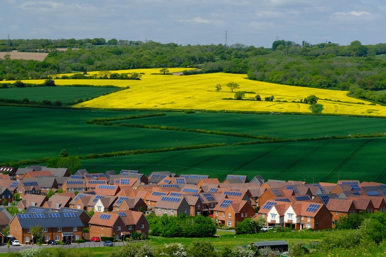 Solar panels on houses in Clanfield, May 2024.