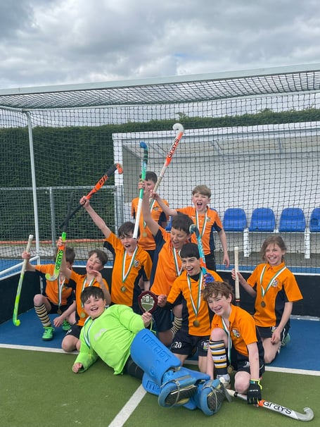 Alton Hockey Club's under-ten boys celebrate their success in Oxford