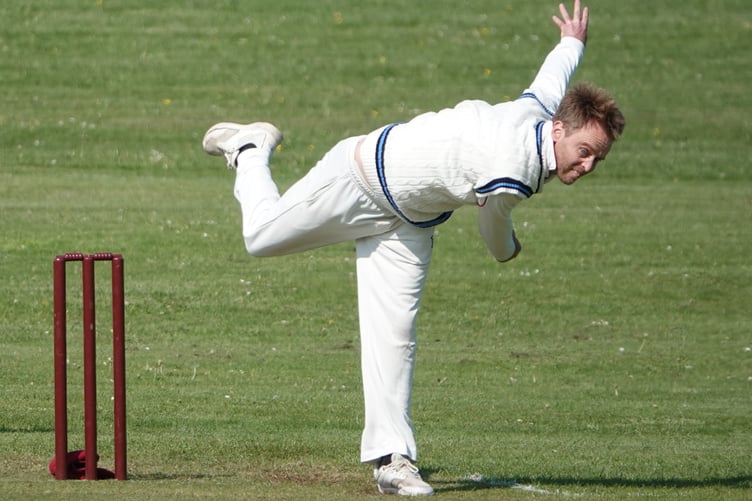 Clanfield bowler Adam Smith in action