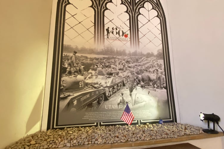 Photo boards were placed in the church windows, each one depicting a different part of the Normandy Landings and telling the story