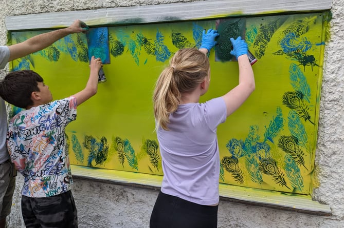 The mural in progress