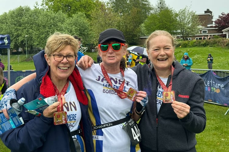 Ann Varnes, Janet Govan and Karen Sinclair proudly show off their medals