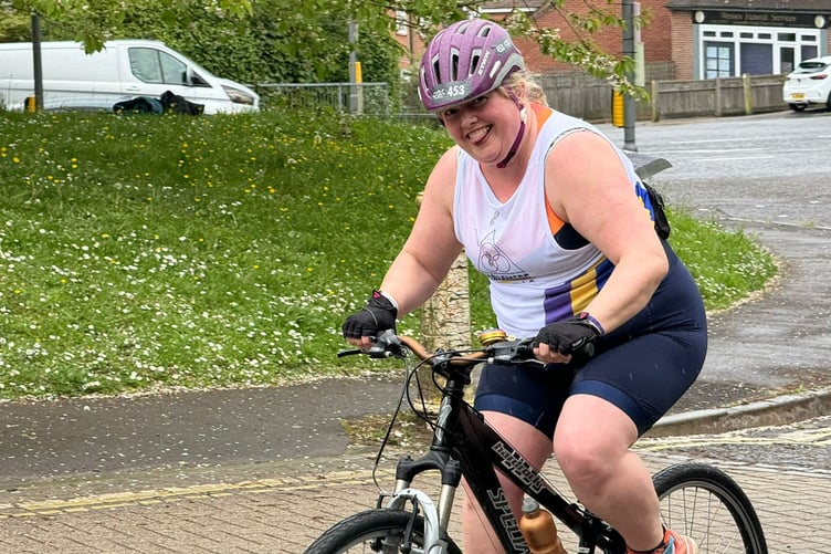 Tina Parmenter still smiling as she powers to the finish of the cycle ride