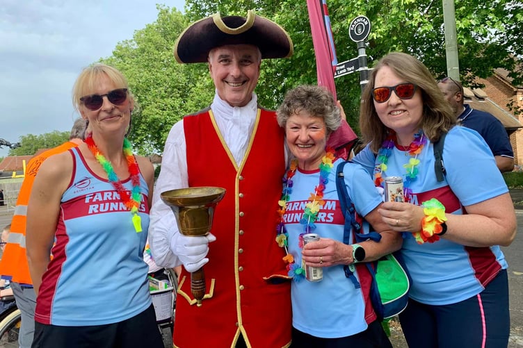 Farnham Runners' Sue Taylor, Linda Tyler and Nicola O'Connor at the Farnham Carnival with the town crier