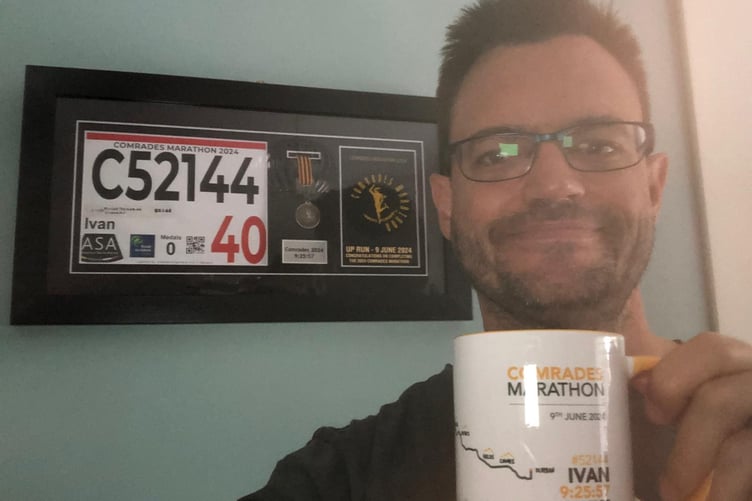 Ivan Chunett with his Comrades Marathon medal and mug
