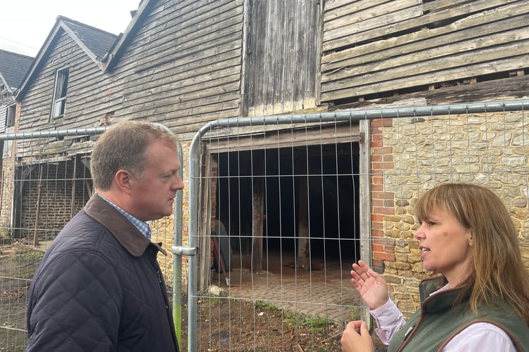 Gregg Stafford hearing about the work that is about to be done on the old barn