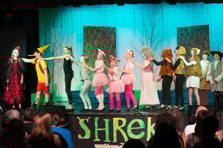 St Ives pupils performing Shrek the Musical
