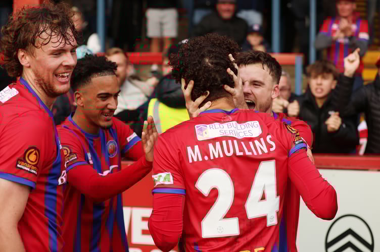 Maxwell Mullins is congratulated after scoring Aldershot's last-minute winner (Photo: Ian Morsman)