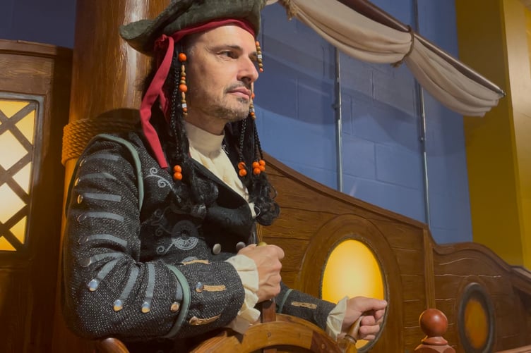 Pirate Pete manning the helm at Pirates Landing