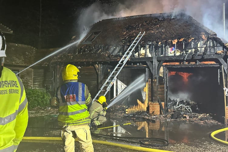 Fire crews from Hampshire and Surrey tackle the blaze at a family home in Churt on November 15 2024