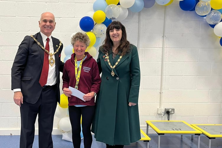 Linda Tyler is presented with her prize