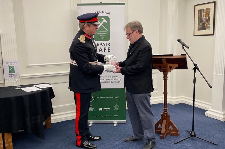Martin Charter of Farnham Repair Cafe receives the King's Award from Michael More-Molyneux, Lord-Lieutenant of Surrey