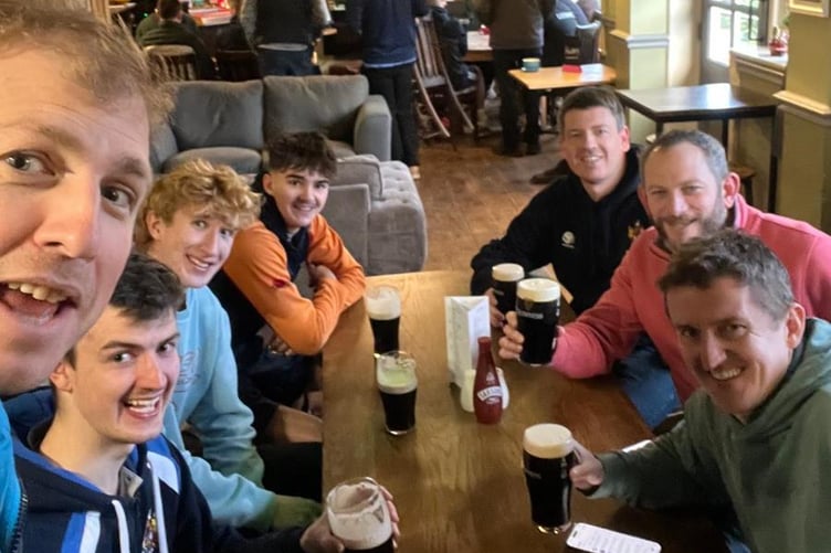 Haslemere Hockey Club's men's second team celebrate their 2-1 win at Wimborne