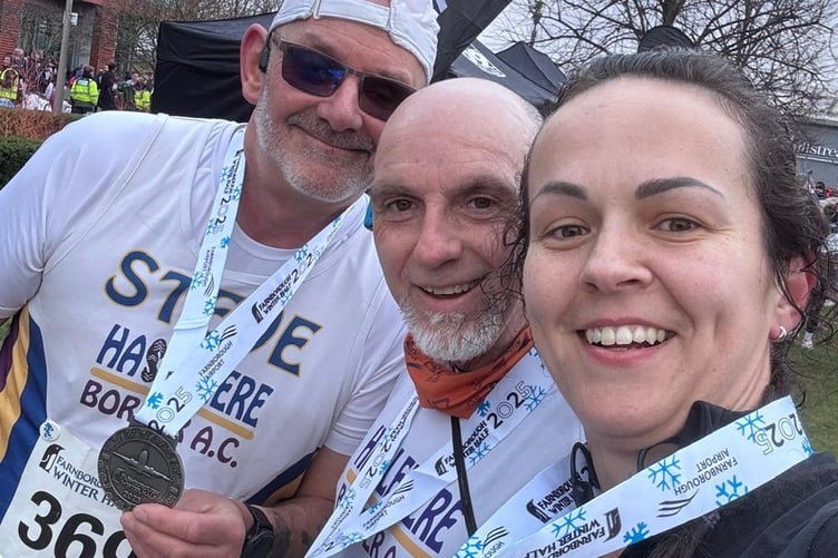 Steve King, Dudley Walker and Gosia Shukla show off their Farnborough Winter Half Marathon medals
