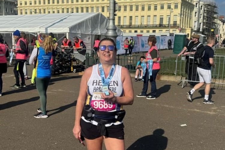Helen Crainey shows off her Brighton Half Marathon medal