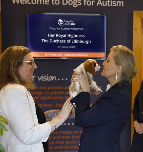 The Duchess of Edinburgh with Louis, a puppy in training at Dogs for Autism, Alton.