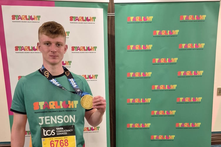 Jenson with his marathon medal.