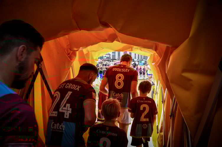 Sonny Boyce leads the team out at Farnham Town FC.