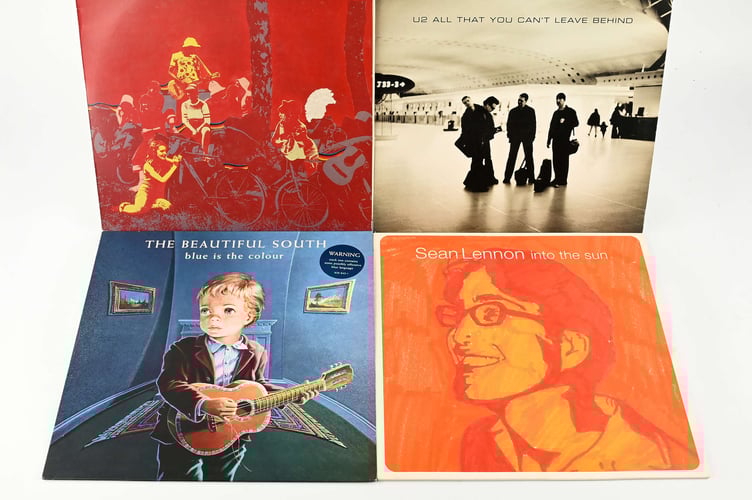 A collection of 1990s albums featuring artists such as Billy Bragg, The Chemical Brothers, and U2.
