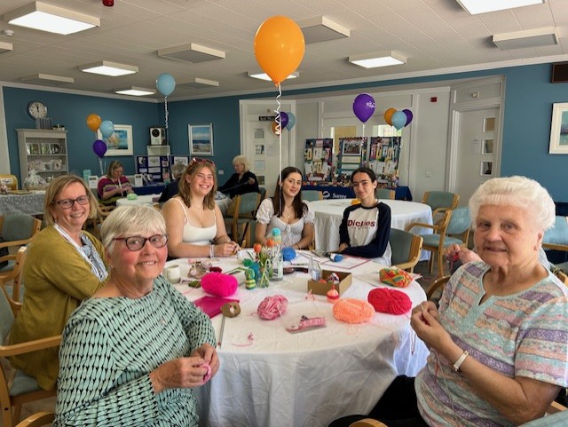 Knitting across the ages to mark VE Day and Surrey Day