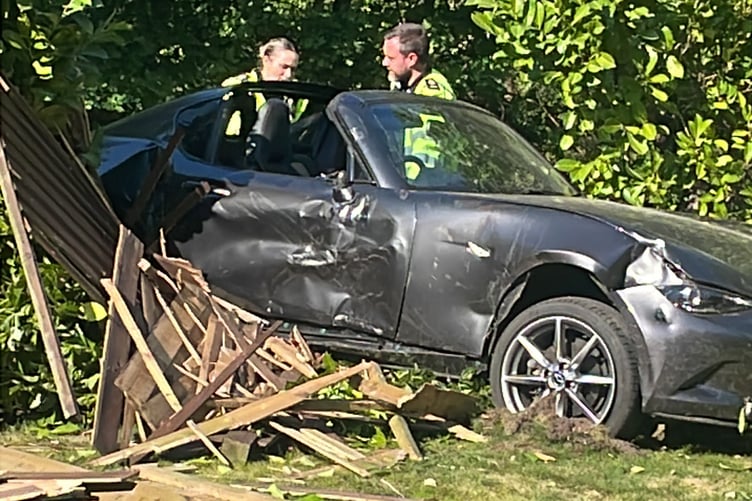 Car through hedge at Littleworth Crossroads
