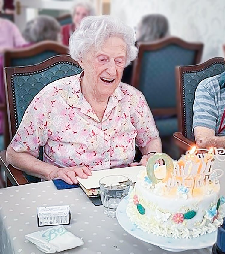 Joyce Douglas, Resident at Friends of the Elderly's Redcot Residential Care Home in Haslemere  Enjoying Her 100th Birthday
