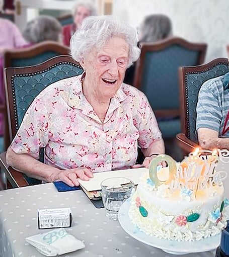 Joyce Douglas, Resident at Friends of the Elderly's Redcot Residential Care Home in Haslemere  Enjoying Her 100th Birthday