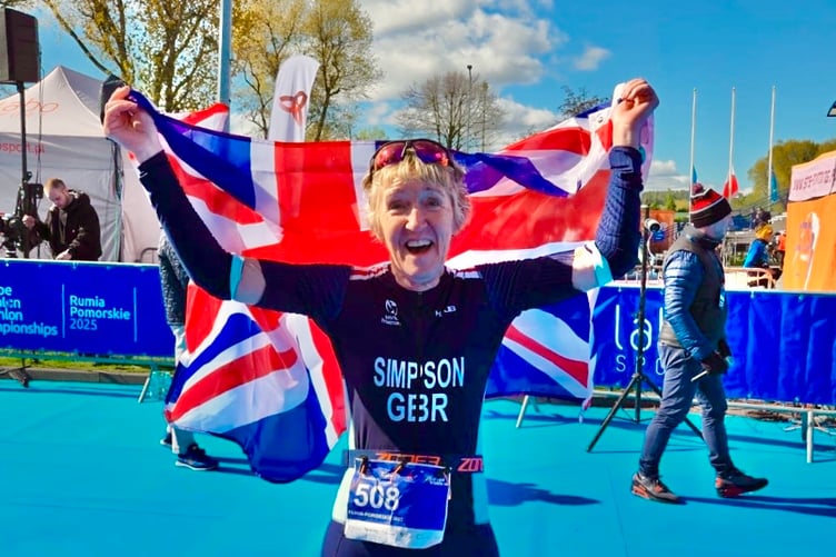 Amanda Simpson celebrates winning a bronze medal at the European Sprint Duathlon Championships