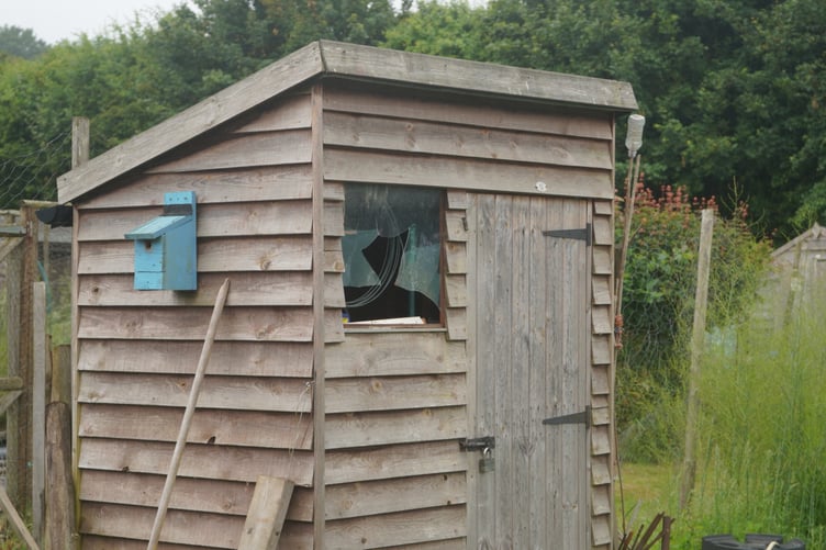 Smashed shed window in Wrecclesham