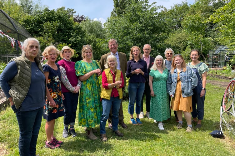 Lord-Lieutenant of Surrey, Michael More-Molyneux, centre, with Space2Grow volunteers at the Big Lunch event in Farnham on Friday, June 6.