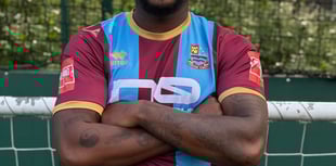 Town boss delighted to sign striker