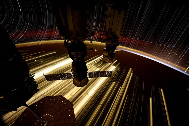 Starlink satellites are featured in this file photo (Dec 2024) taken by NASA astronaut Don Pettit from the International Space Station (ISS). He said: "This one shows atmospheric airglow, yellow-green at 120km and the fainter upper red at 400km, star trails moving in arcs on the left and straight lines on the right, Starlink satellites flashing sunlight off their solar panel, the Cygnus cargo vehicle (left), my Soyuz vehicle (center), and the Russian laboratory module MLM (right)." An astronaut has shared the jaw-dropping view from his workplace window - aboard the International Space Station (ISS). American spaceman Don Pettit used long exposure camera techniques to shoot a trio of images looking out a window on the SpaceX Dragon crew spacecraft attached to the ISS. His pictures show the Pacific Ocean as viewed off the coasts of New Zealand, Australia and also Mexico. Another image shows Starlink satellites flashing sunlight off their solar panels and atmospheric airglow above Earth. British researchers are working to solve the problem of Elon Musk's reflective satellites - by painting them black. A new partnership between Surrey NanoSystems and the University of Surrey is aiming to tackle the growing problem, a major concern for astronomers worldwide. Their latest innovation, Vantablack 310, is a super-black coating designed to dramatically reduce the glare from satellites that interferes with astronomical observations. Only 2% of incoming light is reflected by the surface after product is applied, while the remaining 98% is absorbed. More than 8,000 low Earth orbit (LEO) satellites already orbit Earth and projections estimate a rise to 60,000 by 2030, partly driven by the development of mega-constellations.