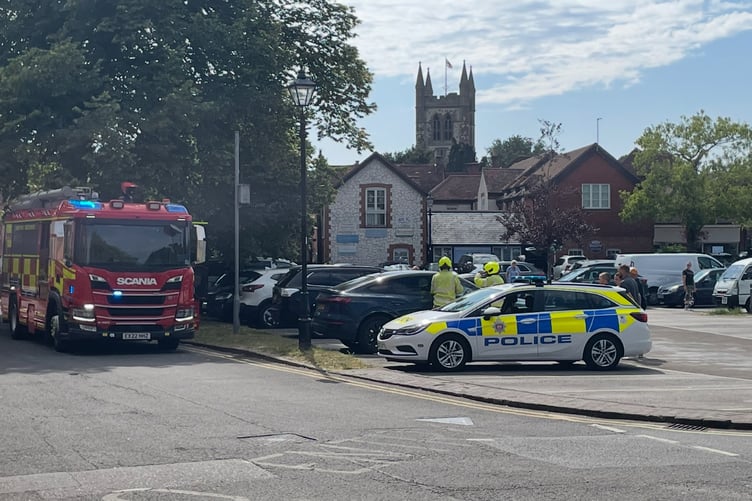 Firefighters and police rescue a child from a car in Central Car Park.
