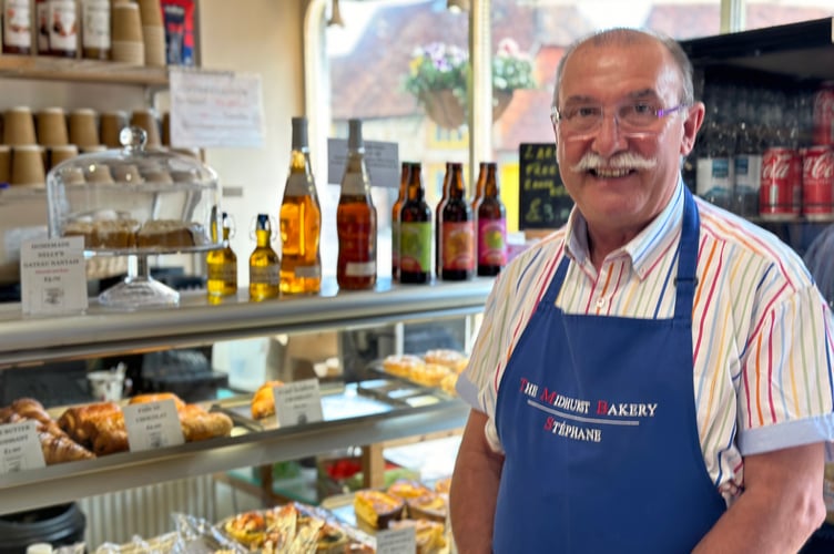 Stephane Jacob, owner of The Midhurst Bakery, wants something done about the ugly scaffolding in the heart of his town
