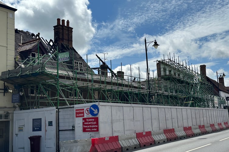 The scaffolding around the Angel Inn completely cuts off the road and is an "eye-sore"