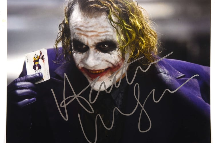 A signed photo of Heath Ledger as the Joker in The Dark Knight.