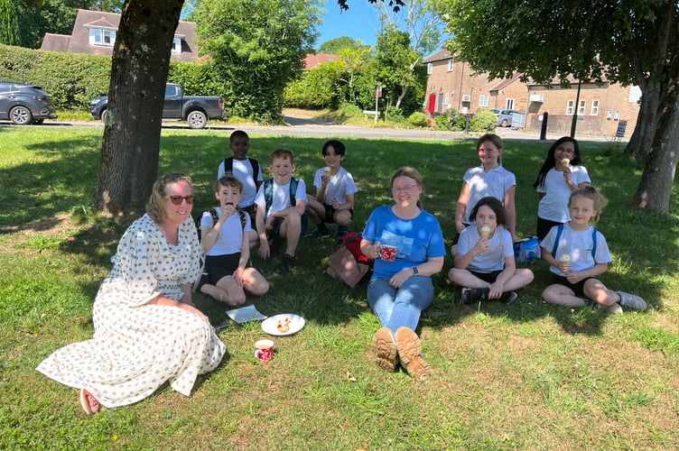 Villagers enjoy a cream tea in the sunshine at the Fernhurst Hub’s annual summer gathering